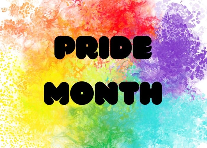 Text that says Pride Month on a rainbow colored background that looks like multicolored smoke. LGBTQ+