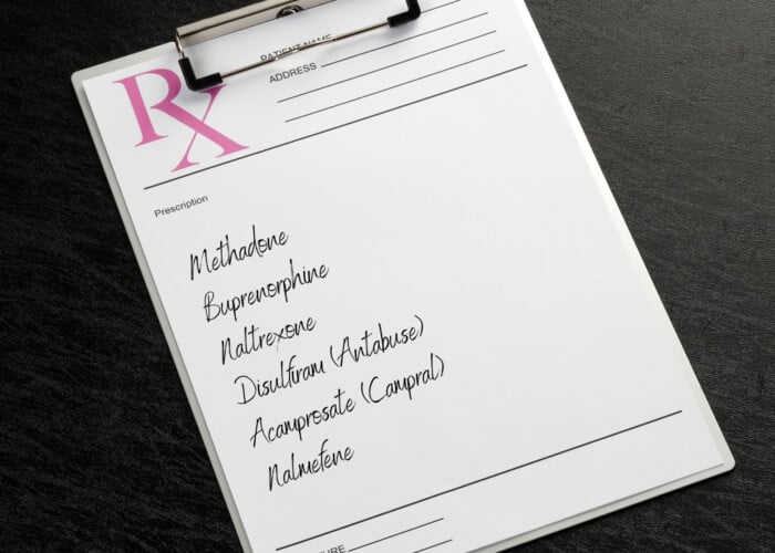 Picture of a prescription pad with the medications methadone buprenorphine naltrexone dsilfram acamprosate and nalmefene. All medications for alcohol or opioid use disorder treatment